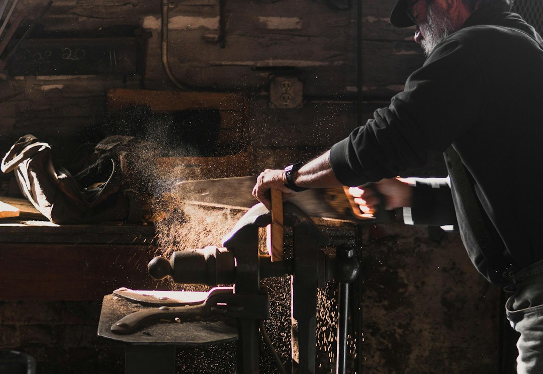 A woodworker at a workshop bench; reference photograph illustrating practical making.